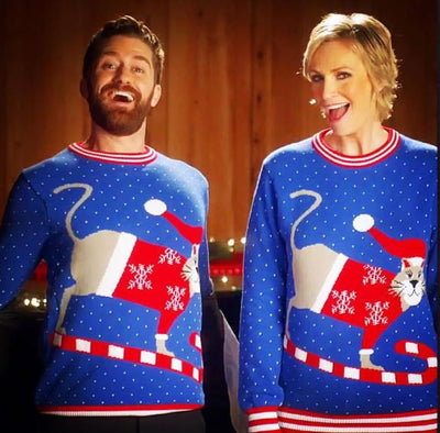 Jane Lynch and Matthew Morrison wear our Sledding Cat Sweater in Febreze Commercial